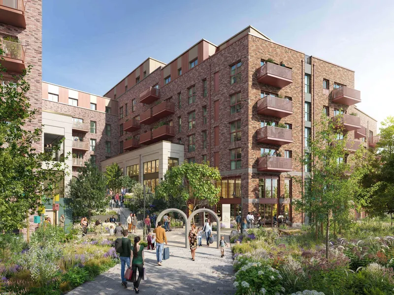Landscaped street with planting and brick balconies above