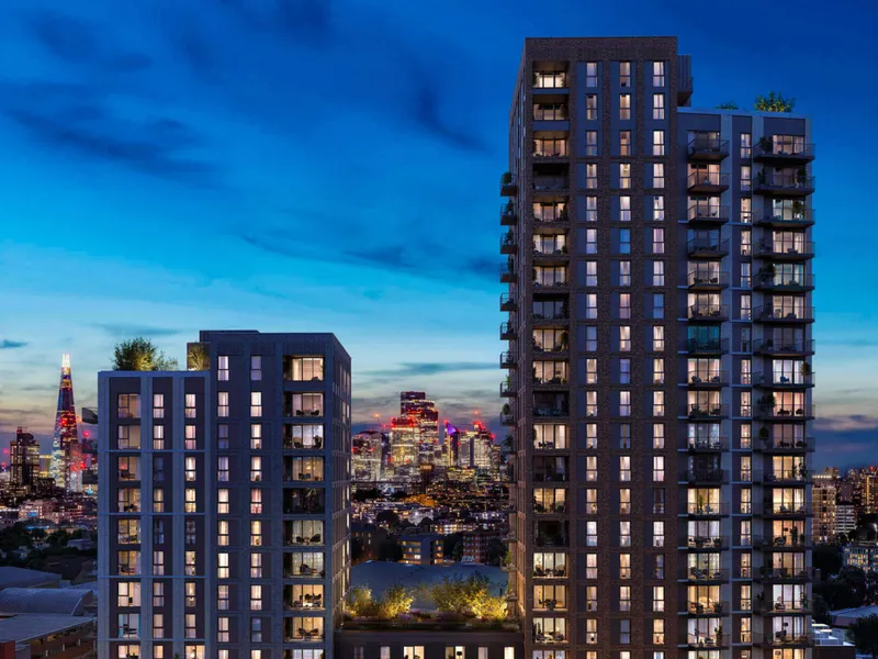 The tower at dusk above the lit city