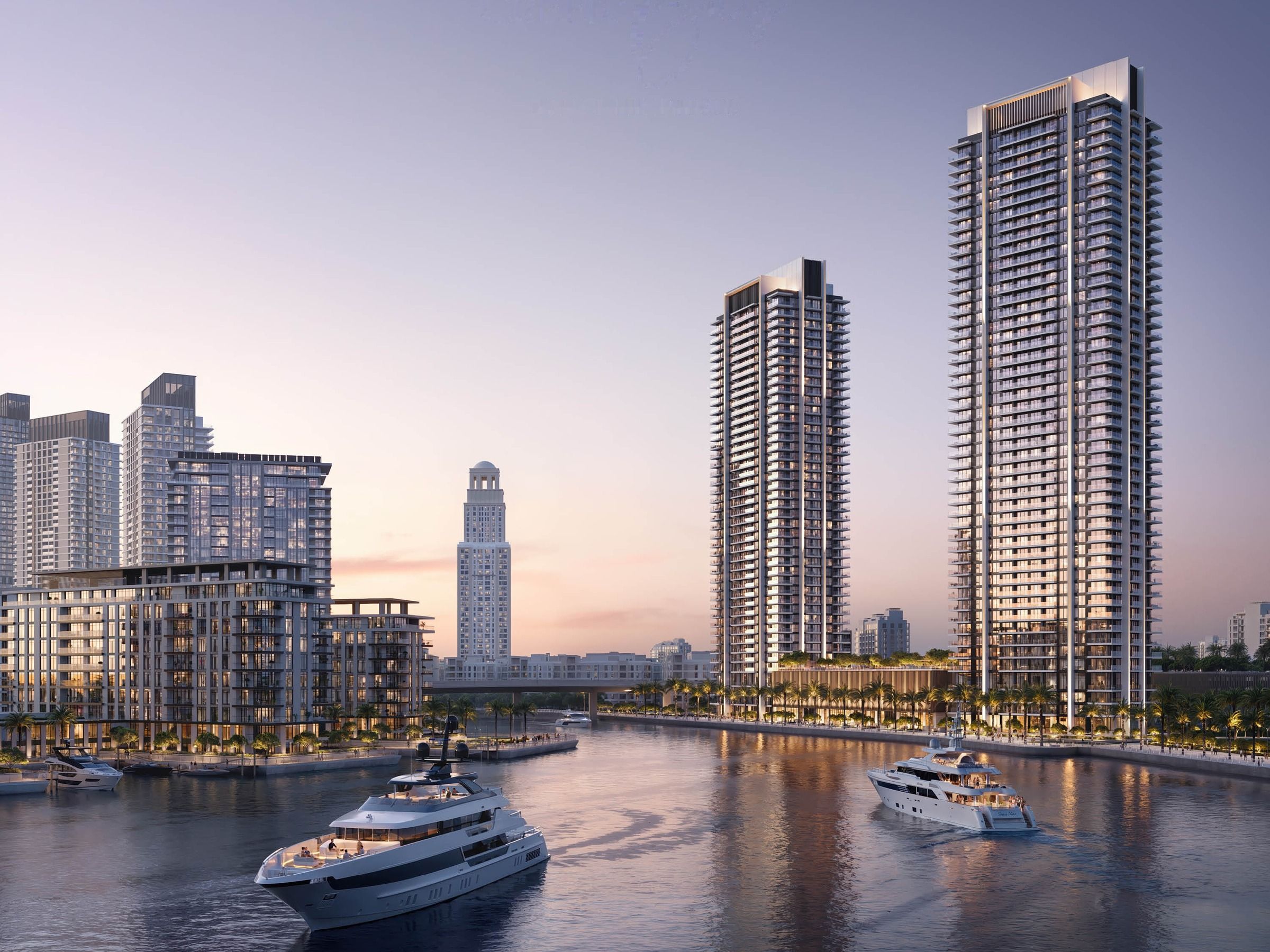 Towers seen from the water at dusk with yachts moored in front
