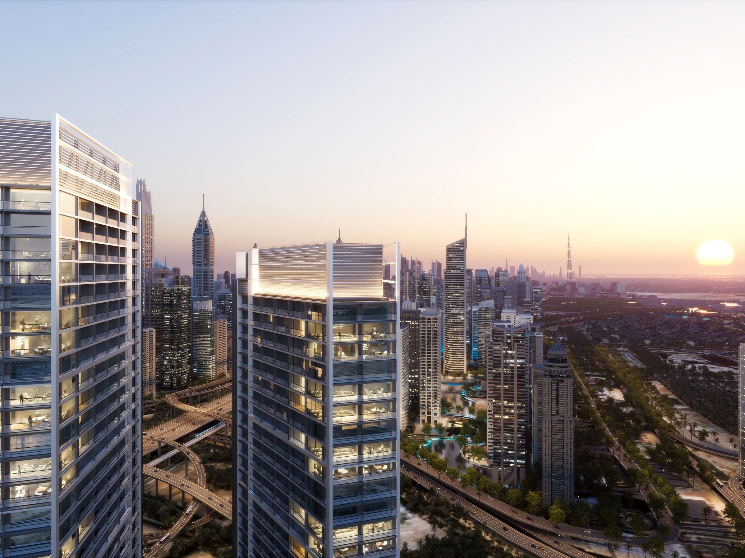 The towers at sunset above the highway and the city beyond