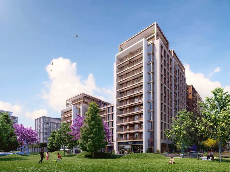 An apartment building with balconies facing the park