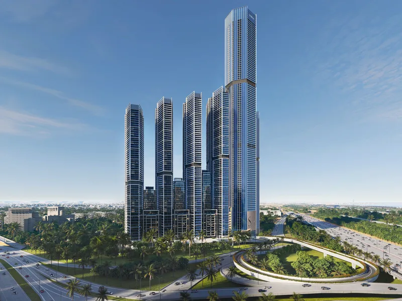 The towers seen from the road with landscaped ground in front